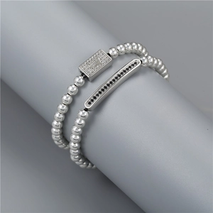 Detail of beaded crown bracelets with micro-paved black and white cubic zirconia