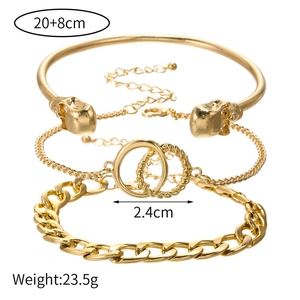 Detailed view of 3-piece gold skull and chain bracelet set with size specifications