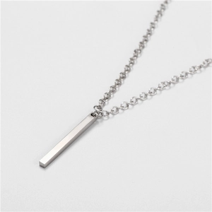 Detail view of silver stainless steel bar pendant with a brushed metallic texture