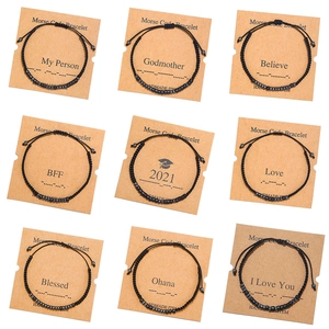 Nine-piece set of handmade Morse code bracelets with black beads on kraft gift cards