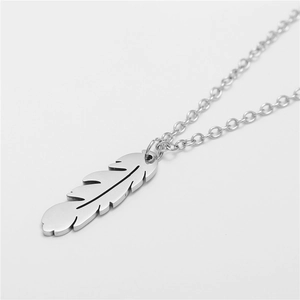 Minimalist silver stainless steel feather pendant necklace with detailed metal texture