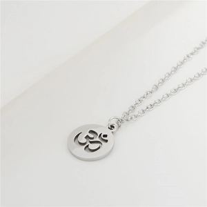 Punk style stainless steel necklace featuring a hollow round Om symbol pendant in silver