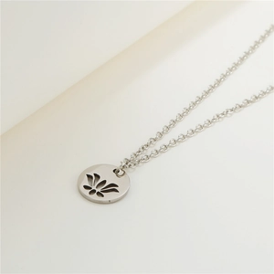 Minimalist silver stainless steel necklace featuring a hollowed-out lotus flower pendant