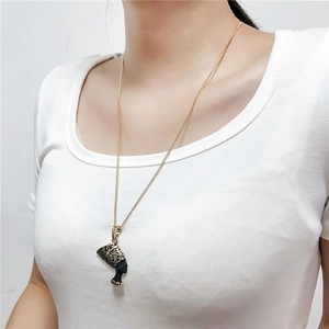 Detail view of Egyptian Nefertiti queen pendant necklace in gold and matte black finish