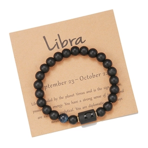 Vista detallada de la pulsera Libra con cuentas negras mate y piedra ojo de tigre azul