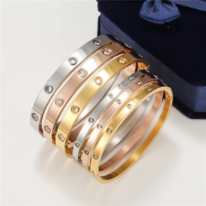 Set of six screw pattern bracelets in silver, gold, and rose gold with inlaid zircons