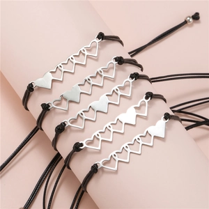 Set di 5 braccialetti dell'amicizia regolabili con cuore in acciaio inox su base rosa