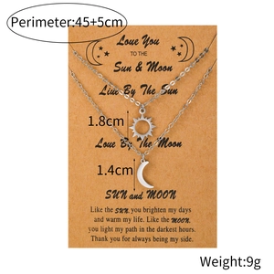 Detailed view of silver sun and moon friendship necklaces with size measurements
