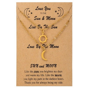 Friendship necklace set with gold stainless steel sun and moon pendants on gift card