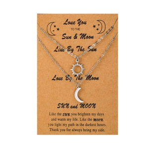 Titanium steel sun and moon pendant necklace set for couples on gift card packaging