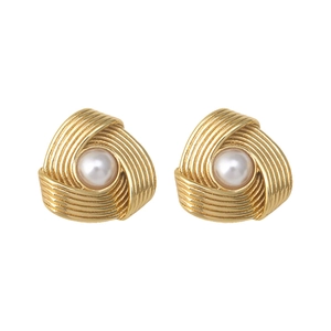 Golden spiral stainless steel stud earrings with central pearl on white background