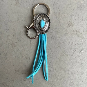 Vintage western turquoise pendant keychain with sky blue suede tassels and silver emblem