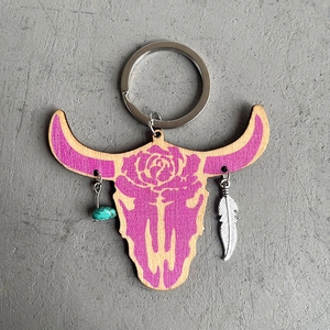 Western bull head wooden keychain with purple roses, turquoise bead, and silver feather charm