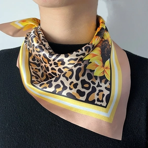 Silk-like square scarf featuring leopard print and yellow sunflower patterns on black