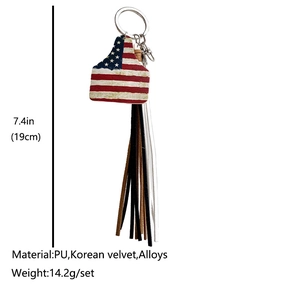 Western cowboy keychain featuring US flag cow tag and multicolored fringe tassel detail