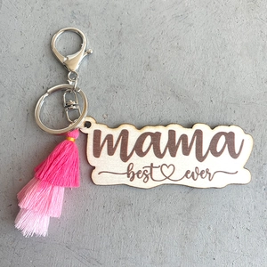 Close-up of wooden mama best ever keychain with pink gradient tassel and silver clasp