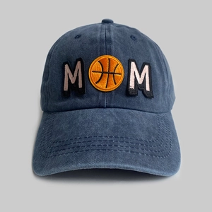 Detailed embroidery of MOM with basketball on washed denim blue baseball cap