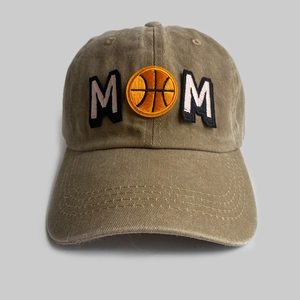 Close-up of MOM basketball embroidery on washed khaki vintage style baseball cap