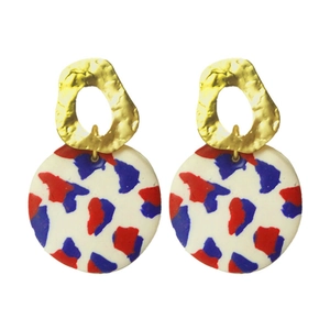 Hammered gold heart-shaped earrings with red and blue polymer clay drop pendants
