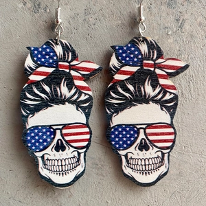 Detail view of Independence Day wood earrings with patriotic skull and flag patterns