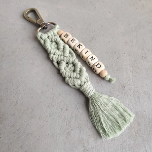Handmade woven cotton keychain with BE KIND wooden beads and soft green tassels