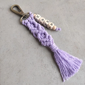 Detail of handmade Macrame tassel keychain with MAMA wooden beads and bronze carabiner