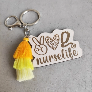 Nurse Life keychain with wooden heart charm, leopard print, and yellow tassel pendant