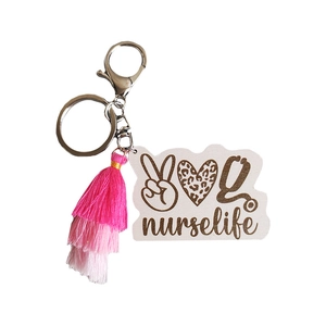 Nurse life keychain with leopard heart icon and pink gradient fringe tassel pendant