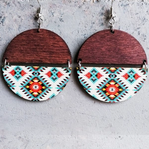 Macro detail of bohemian round wooden earrings with vibrant ethnic geometric patterns