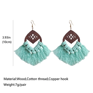 Bohemian tassel earrings with wood geometric cutouts and mint green fringes
