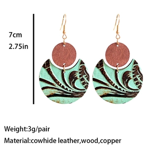 Western style vintage embossed leather earrings with circular wood and teal moon drop
