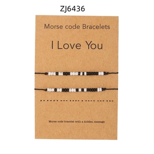 Braccialetti codice Morse I Love You su carta kraft con cordoncini neri intrecciati
