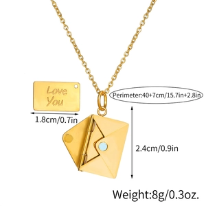 Macro shot of open gold envelope locket with engraved Love You charm and size details