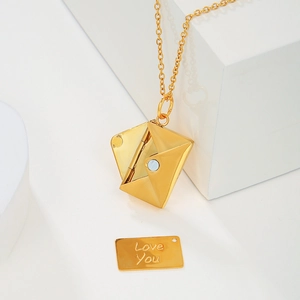 Macro shot of gold envelope pendant with S925 silver mark and Love You engraving