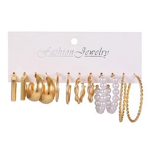 Set of six vintage gold-toned earrings featuring geometric hoops and white pearl studs
