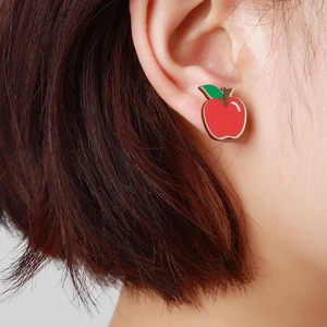 Handcrafted cartoon apple wooden stud earrings worn by model for Easter gift inspiration