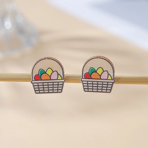 Macro detail of wooden Easter basket stud earrings with colorful hand-painted eggs