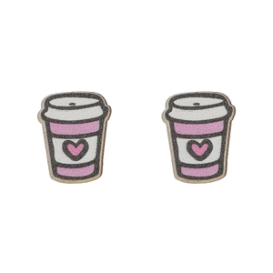 Detail shot of heart-patterned wooden coffee cup earrings with matte print finish