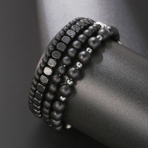 Men's matte black beads and hematite stretch bracelets set shown on a jewelry display