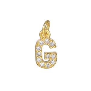 Macro shot of 18k gold plated letter G pendant with micro-pave cubic zirconia stones