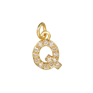 Macro view of 14k gold plated letter Q pendant with micro-pave cubic zirconia stones