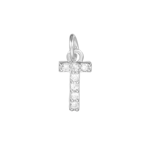Macro shot of silver letter T pendant charm with micro-pave cubic zirconia stones