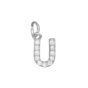 Detailed macro view of silver U-shaped pendant with cubic zirconia for DIY jewelry