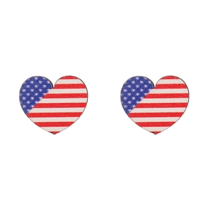 Close-up of heart-shaped wooden earrings with American flag stars and stripes pattern