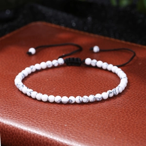 Detail of adjustable braided rope bracelet with 4mm white turquoise stone beads