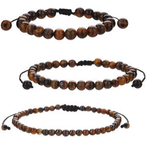 Tiger eye bead bracelets in three sizes with adjustable black braided cords on white background