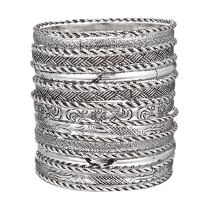 Close-up of retro silver bangles featuring rope texture and floral carvings in 19-piece set