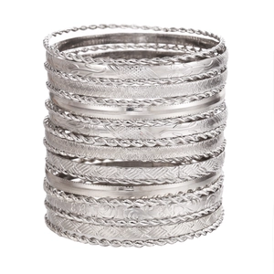 Silver ethnic stacking bangles set with boho hammered and floral engraved details