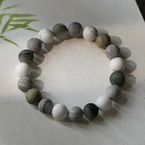 Bracelet en perles de pierre de marbre gris style Zen avec décor feuilles