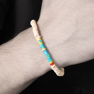 Close-up of bohemian beaded bracelet featuring colorful turquoise and tiger eye stones